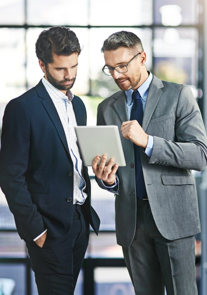 men reviewing a report